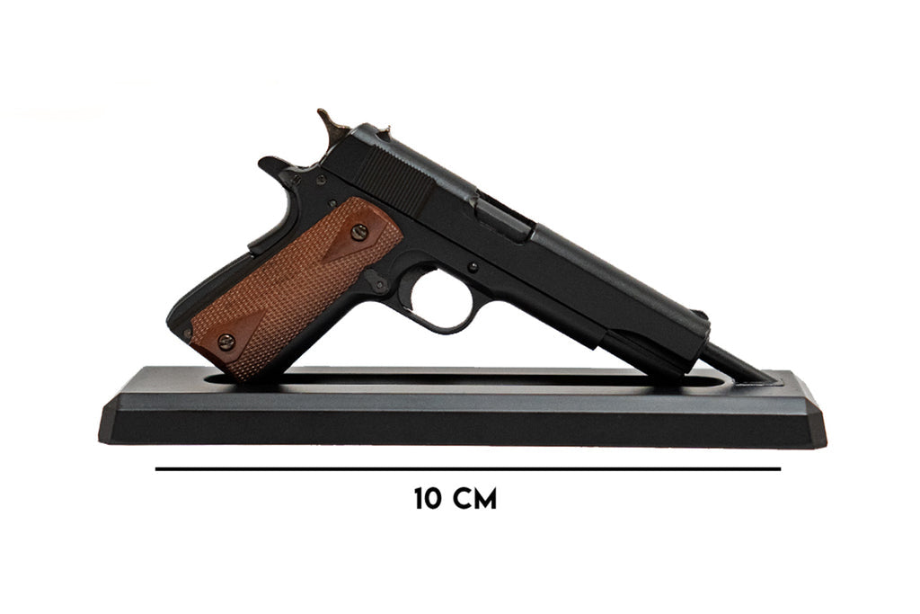 Miniature 1911 pistol model by GoatGuns with wood-pattern grips